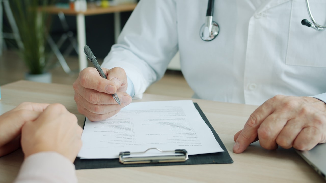 A doctor documenting a patient medical condition