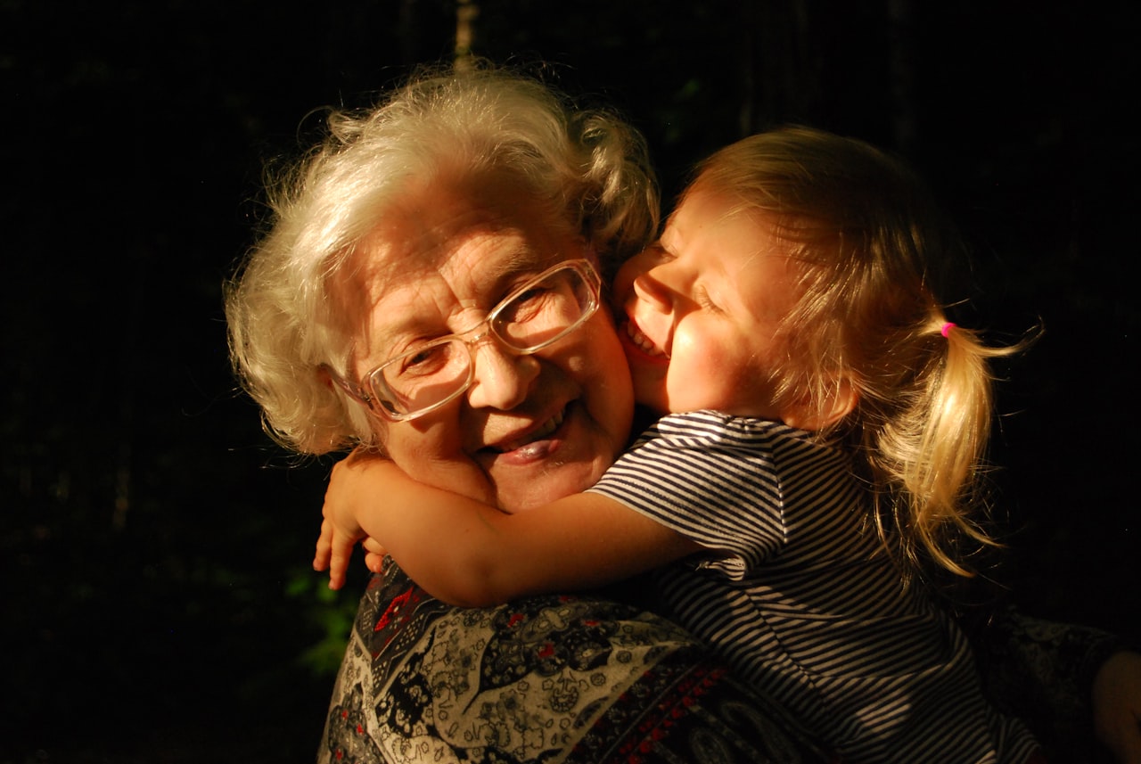 A grandparent hugging a grandchild