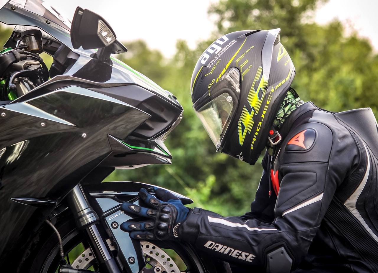 A motorcyclist wearing a DOT-approved helmet